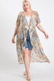 Plus size woman wearing floral kimono over denim shorts and white top