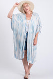 Plus size woman in blue and white tie-dye kimono cover-up with straw hat