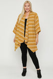 Plus size woman wearing mustard striped kimono cardigan with black pants and boots