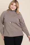 Plus size woman wearing cozy taupe turtleneck sweater with long pendant necklace